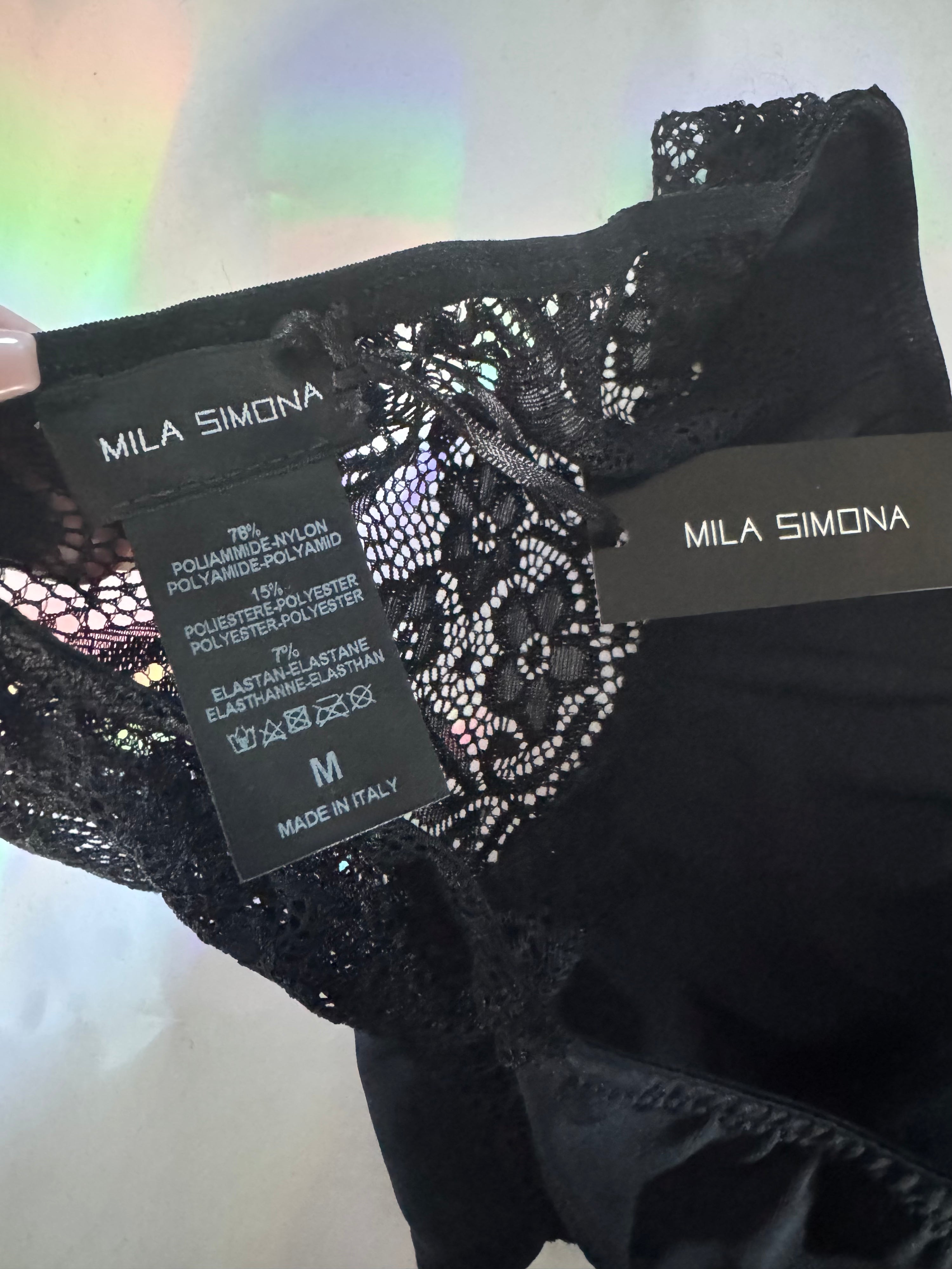 Close up of black lace floral detail on the Somnia brief 