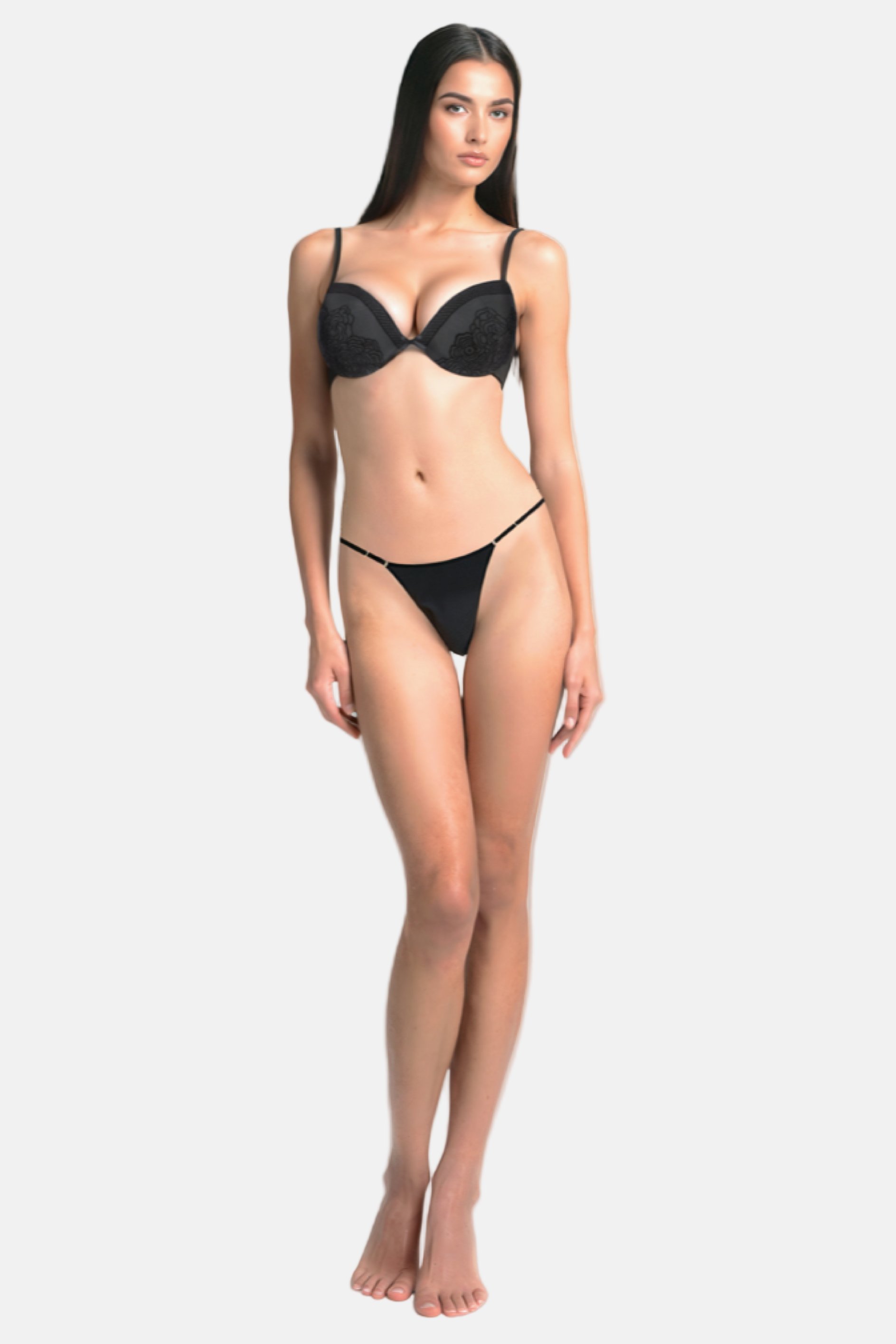 Model wearing a black mesh push-up bra with velvet detail